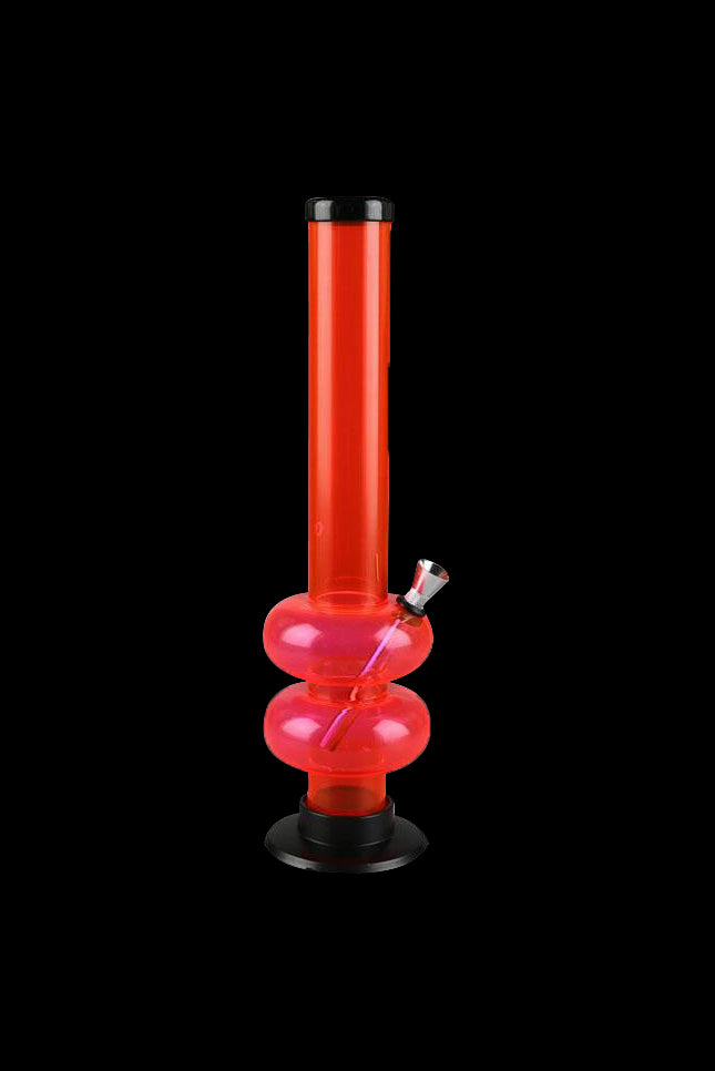 Red acrylic water pipe (bong) against a black background.