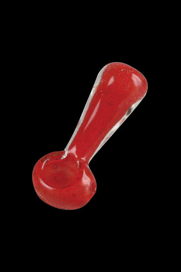 Red glass pipe isolated on a black background.