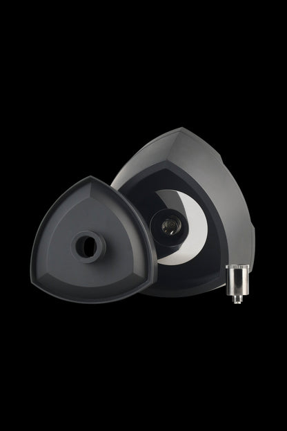 Black cannabis oil vaporizer cartridge and magnetic attachment base.