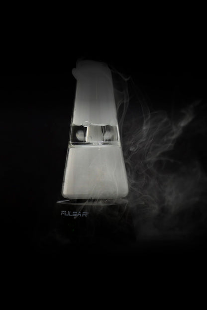 Sleek, white cannabis vaporizer with visible vapor trails against a black background, branded “Pulsar.”
