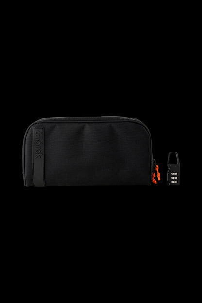 Black, lockable cannabis storage case with orange accents.