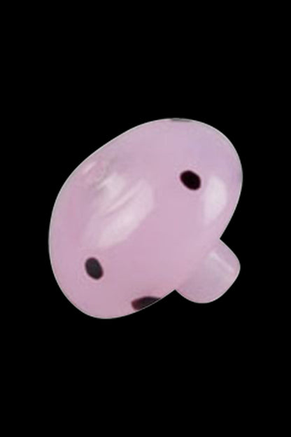 A close-up shot of the Worked Mushroom Carb Cap, showcasing its smooth, rounded shape against a dark background.