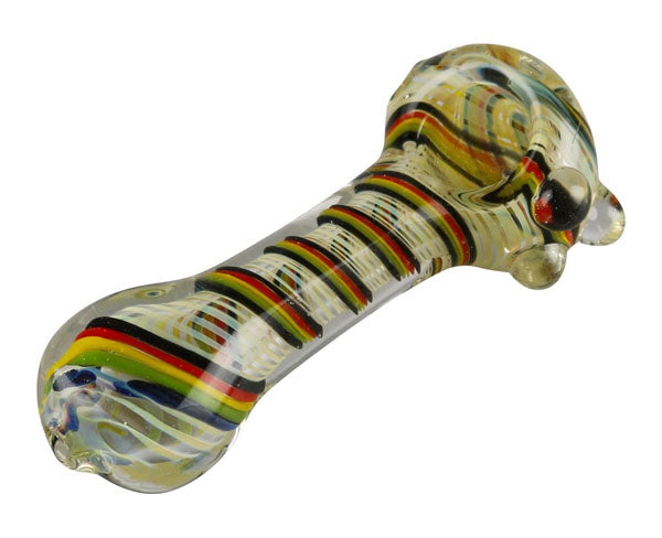 A close-up view of the Worked Rasta Spoon Glass Pipe, showcasing its curved shape and translucent glass material.