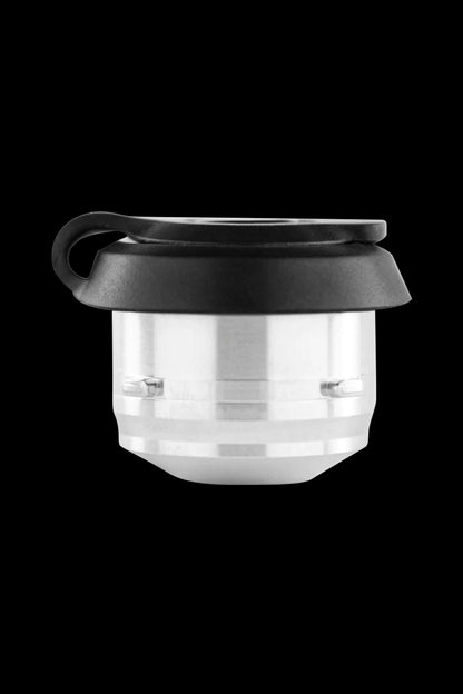 Metal cannabis concentrate container with black silicone cap.