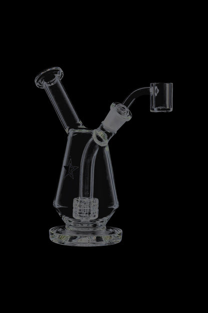 Front view of the Famous X Drip Dab Rig centered on a black background, showing its angled mouthpiece, clear beaker body, and percolator.