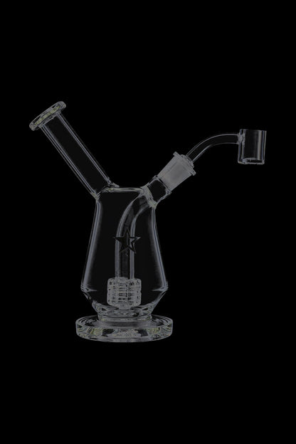 Front view of the Famous X Drip Dab Rig sitting on a black background, showing its angled neck, percolator and star logo.
