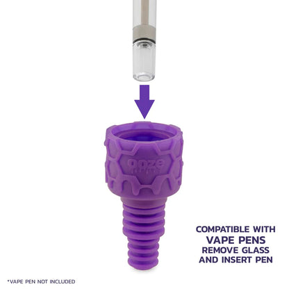 Purple silicone vape pen adapter with directional arrow indicating insertion point for a vape cartridge. <start_of_image>