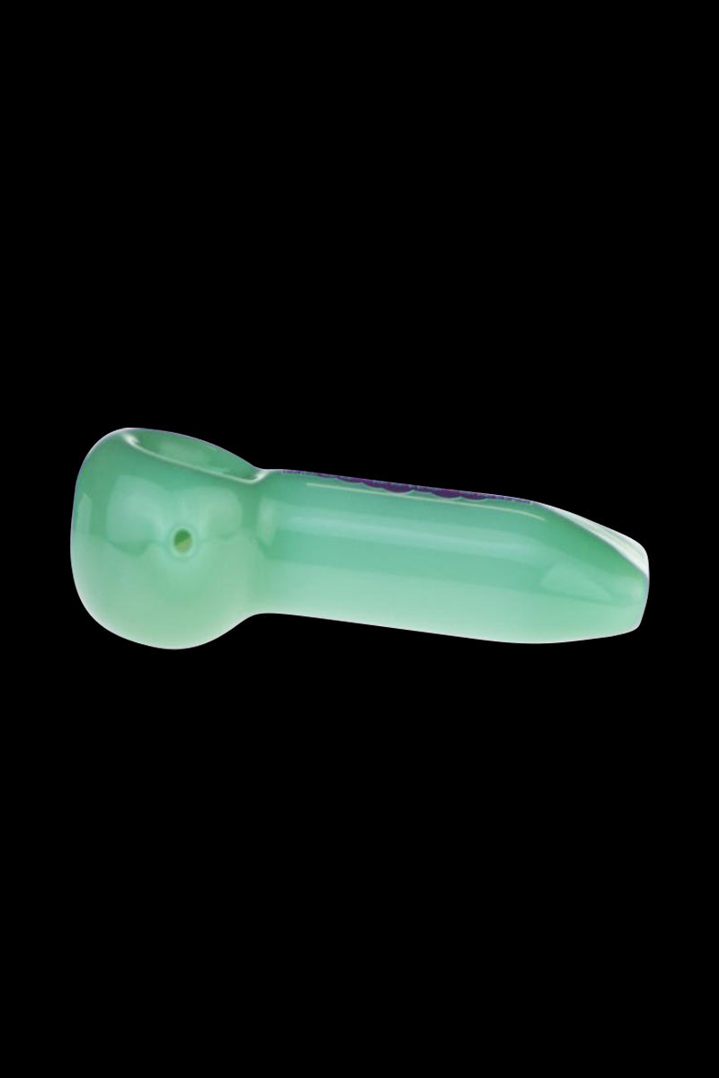 A side view of the 4-inch Puff Puff Pass hand pipe, showcasing its simple glass construction and curved design.