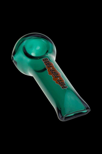 A side view of the Puff Puff Pass 4 Inch Hand Pipe, showcasing its simple, compact design against a dark background.
