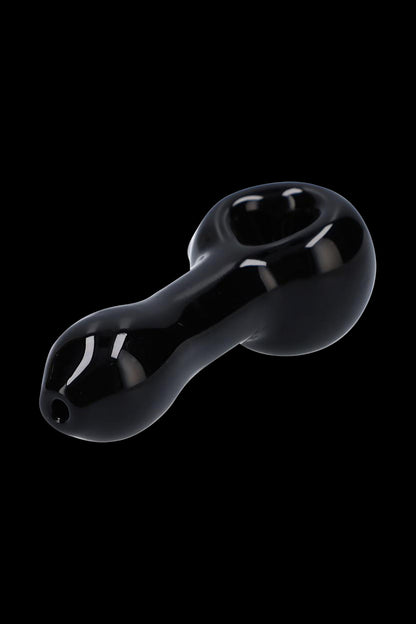 Close-up three-quarter view of the glossy black Rock Legends Glass Spoon Pipe - Jimi NYC against a black background.