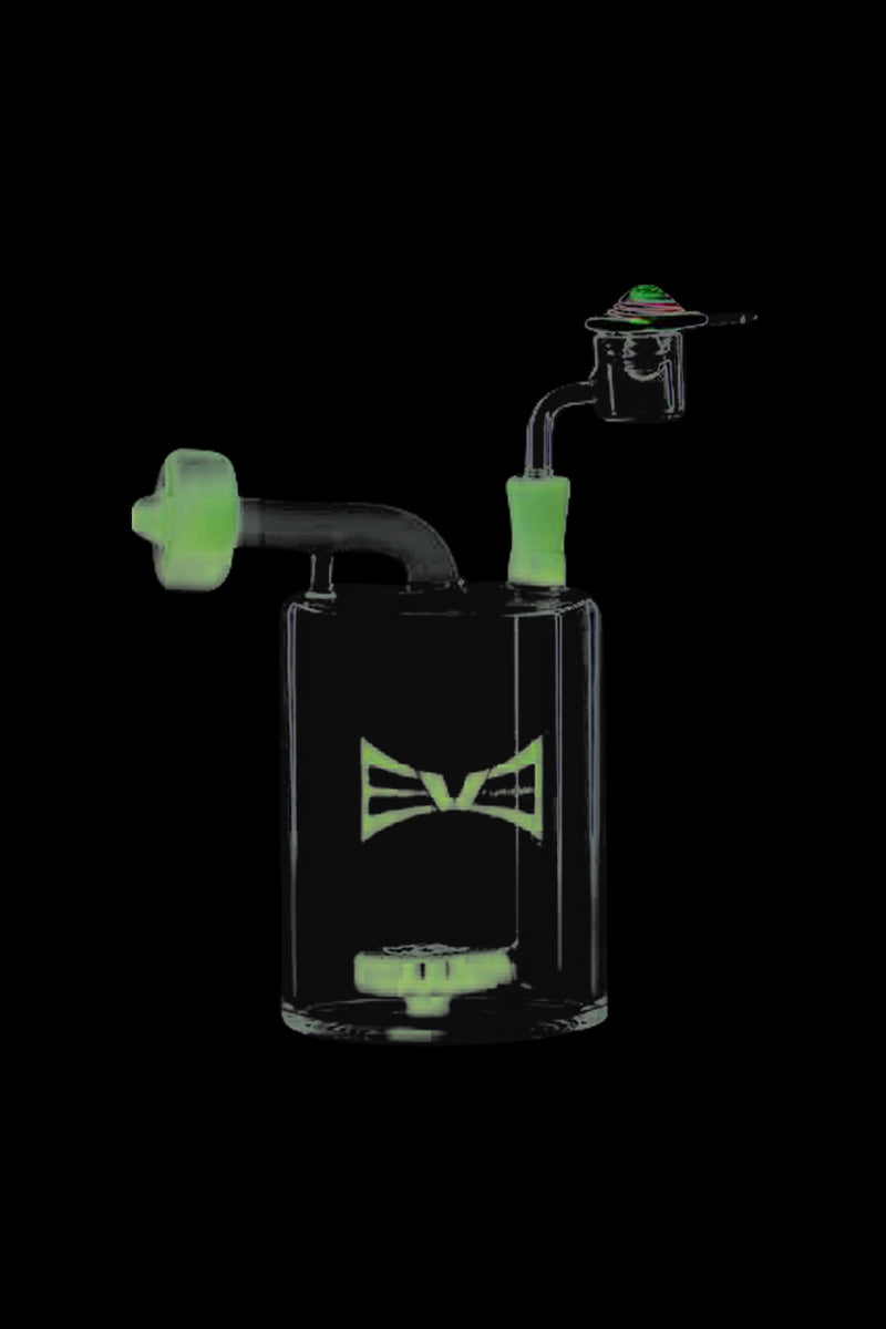 A three-quarter view of the Evolution Money Jar Dab Rig with Banger and Carb Cap, showcasing its clear glass construction and compact size.