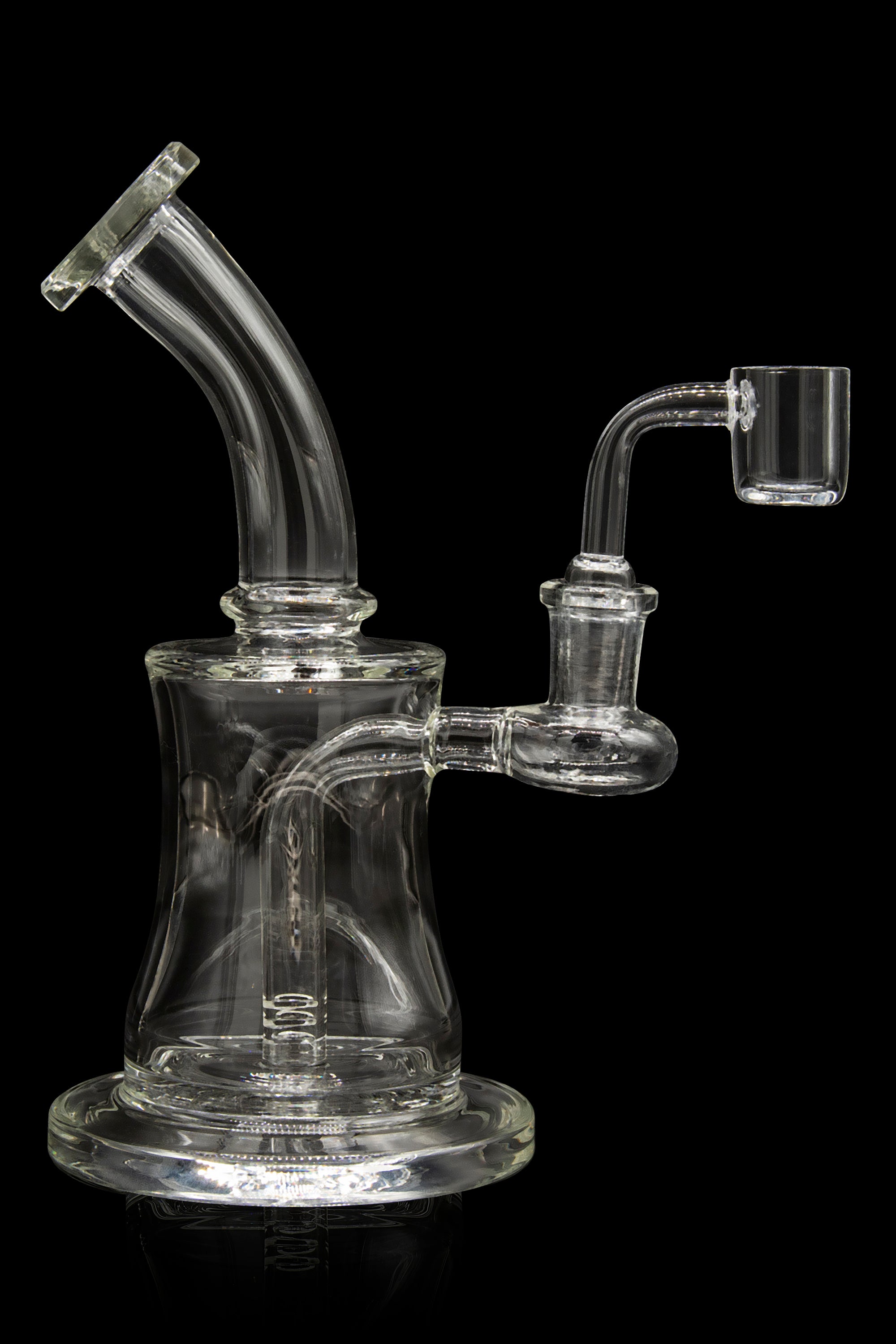 Clear glass dab rig with a bent neck and quartz banger.