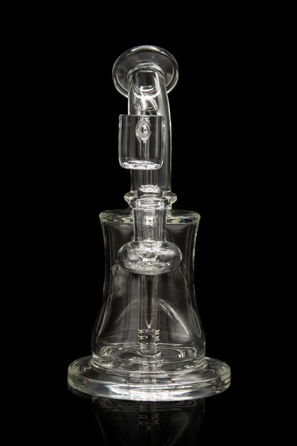 Clear glass water pipe (rig) with intricate design, isolated on a black background.