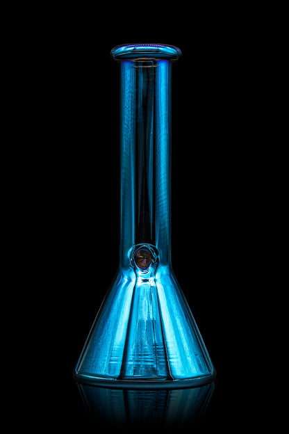 Blue glass bong illuminated against a black background.