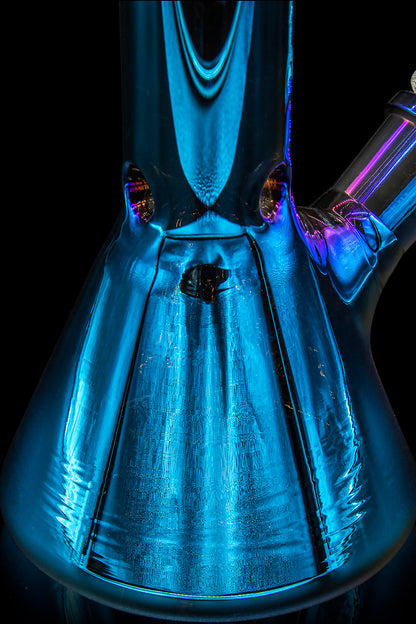 Blue glass bong illuminated with purple and gold light, viewed from within the bowl.