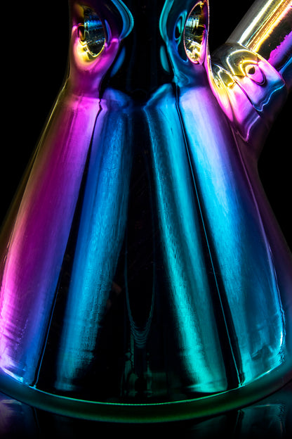 Neon-lit glass cannabis water pipes displayed against a black background.