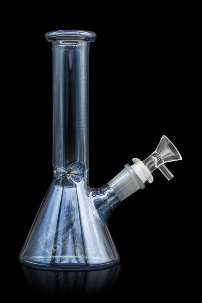 Clear glass bong with a flared base and angled neck, isolated on a black background.