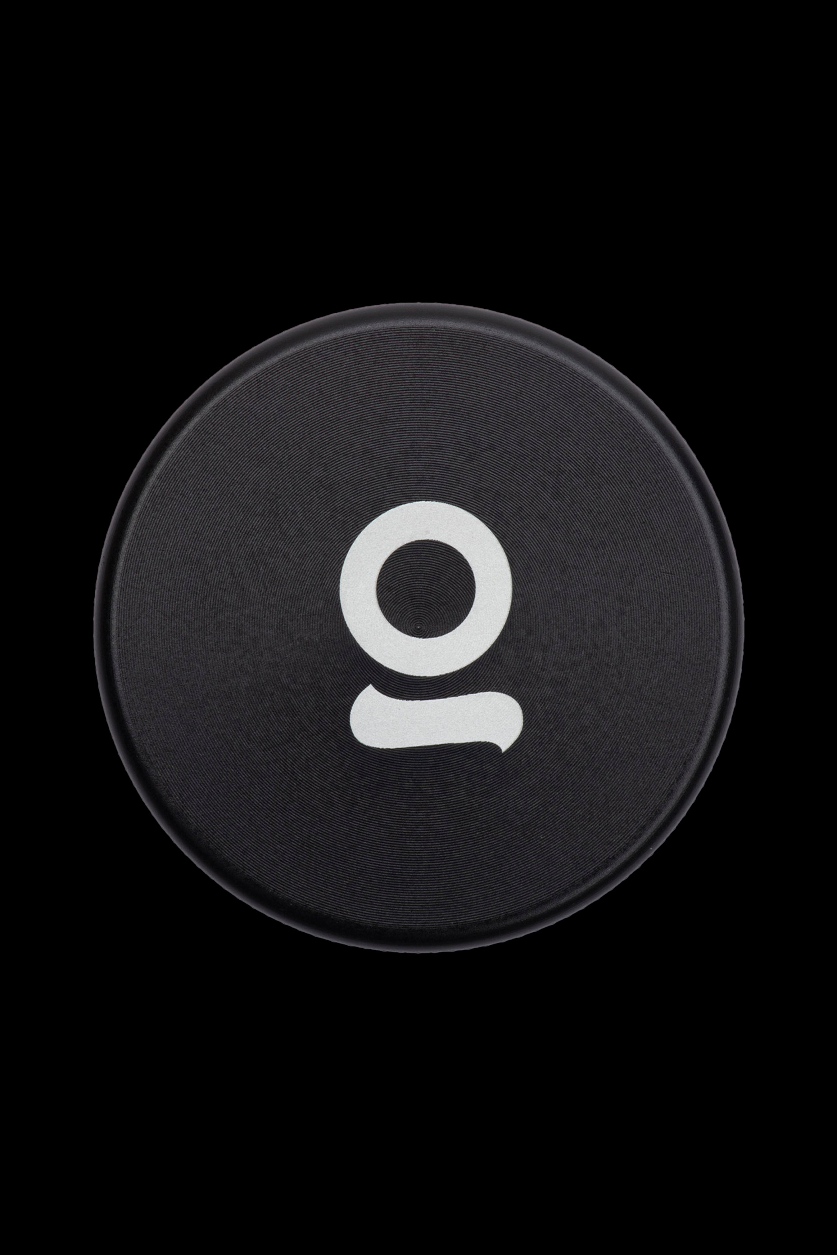 Black cannabis accessory with a white “O” logo.
