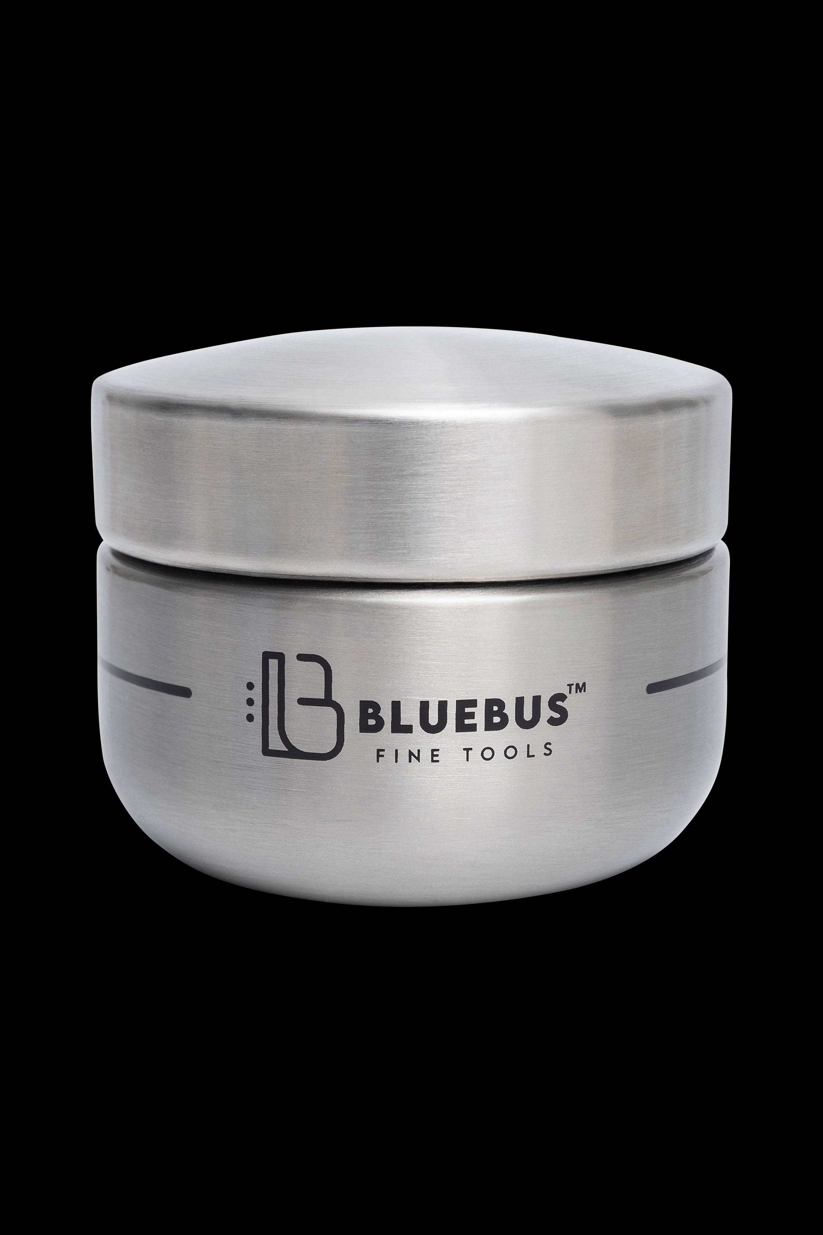 Silver cannabis concentrate container with "Bluebus Fine Tools" logo.
