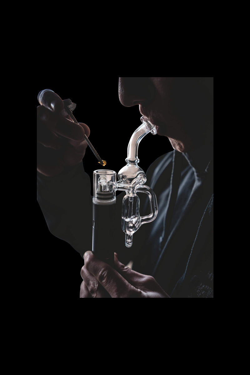 A close-up, angled view showcases the Elite Pro Hyperloop Glass with a sleek, clear design, held against a dark background.