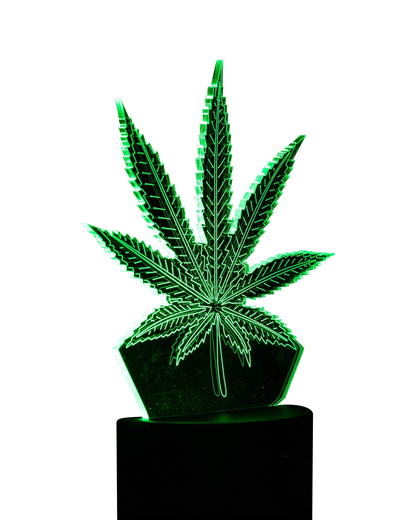 A front view of the 3D Cannabis Leaf Lamp, showcasing a sculpted leaf design in dark tones against a plain background.