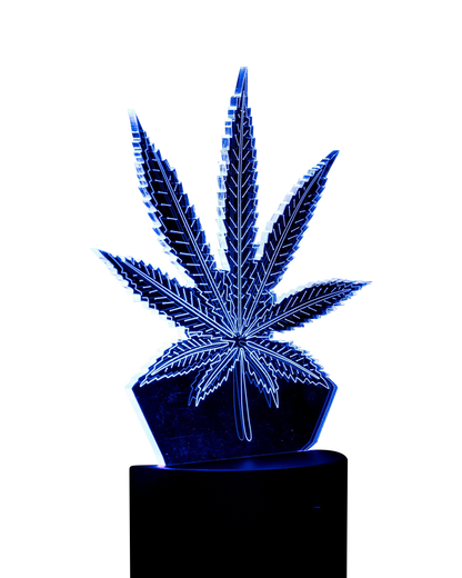 A low-angle shot of the 3D Cannabis Leaf Lamp, displaying a detailed, sculpted leaf design on a black base.