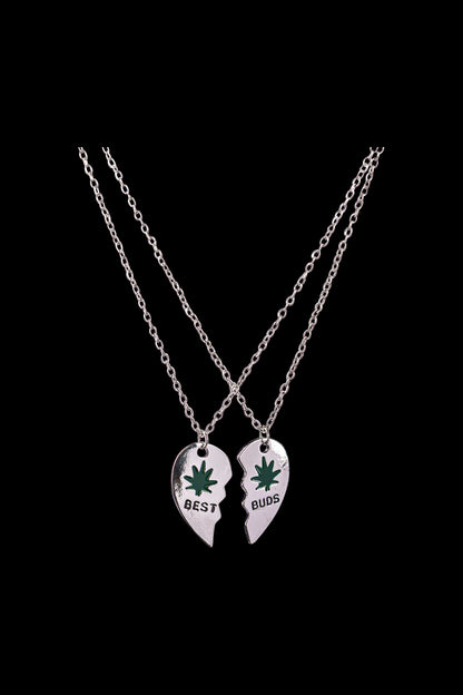 A close-up of the DankStop Best Buds Sharable Necklace, featuring two interlocking pendants on silver chains.
