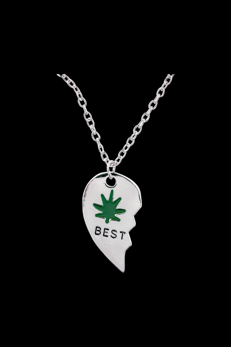 A close-up shot of the silver DankStop Best Buds Sharable Necklace, featuring two interlocking halves suspended on a delicate chain.