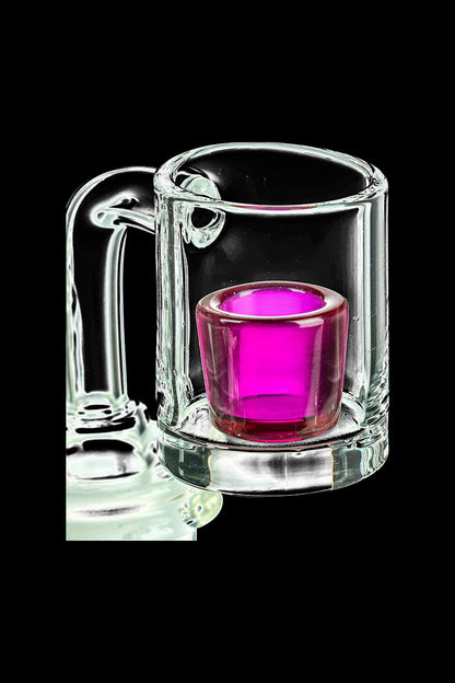 A close-up, angled view of the E-Rig Compatible Ruby Quartz Cup Insert, showcasing its vibrant ruby color within a clear glass container.