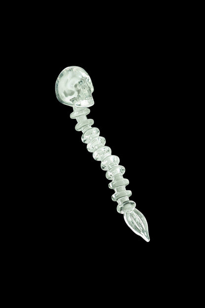 A close-up of the Fatality Dabber, showcasing its sculpted glass design against a dark background.