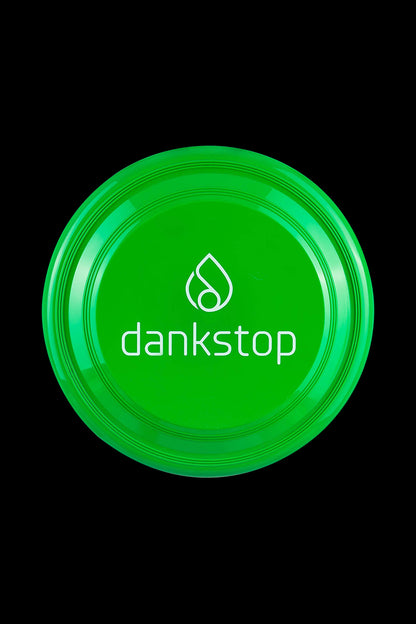 Frisbee disc captured in a clean, top-down studio shot against a stark black background.