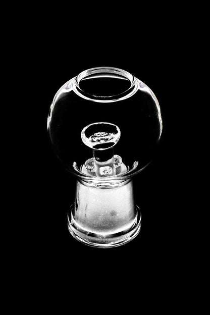 A front view of the Glass Dome and Nail, showcasing a clear glass dome positioned above a small, cylindrical nail.