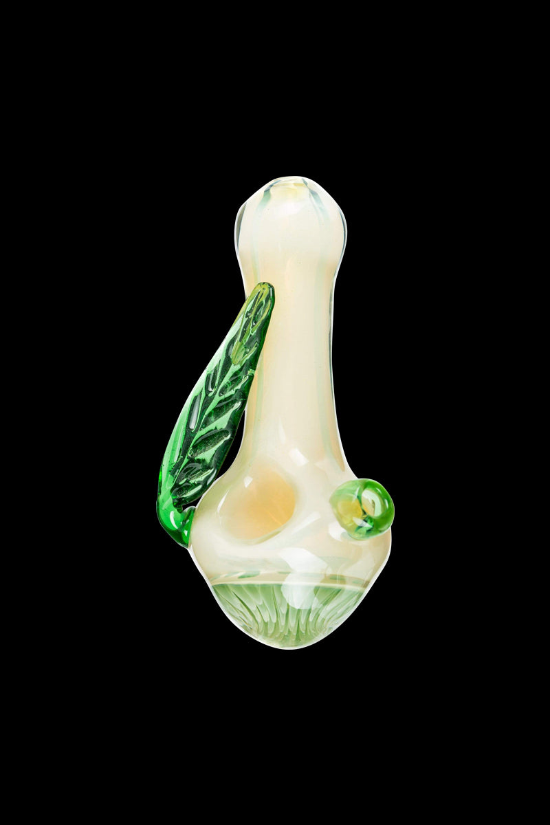 A side view of the Leafy Green Mushroom Milli Spoon Pipe, showcasing its curved shape and green-tinted glass.