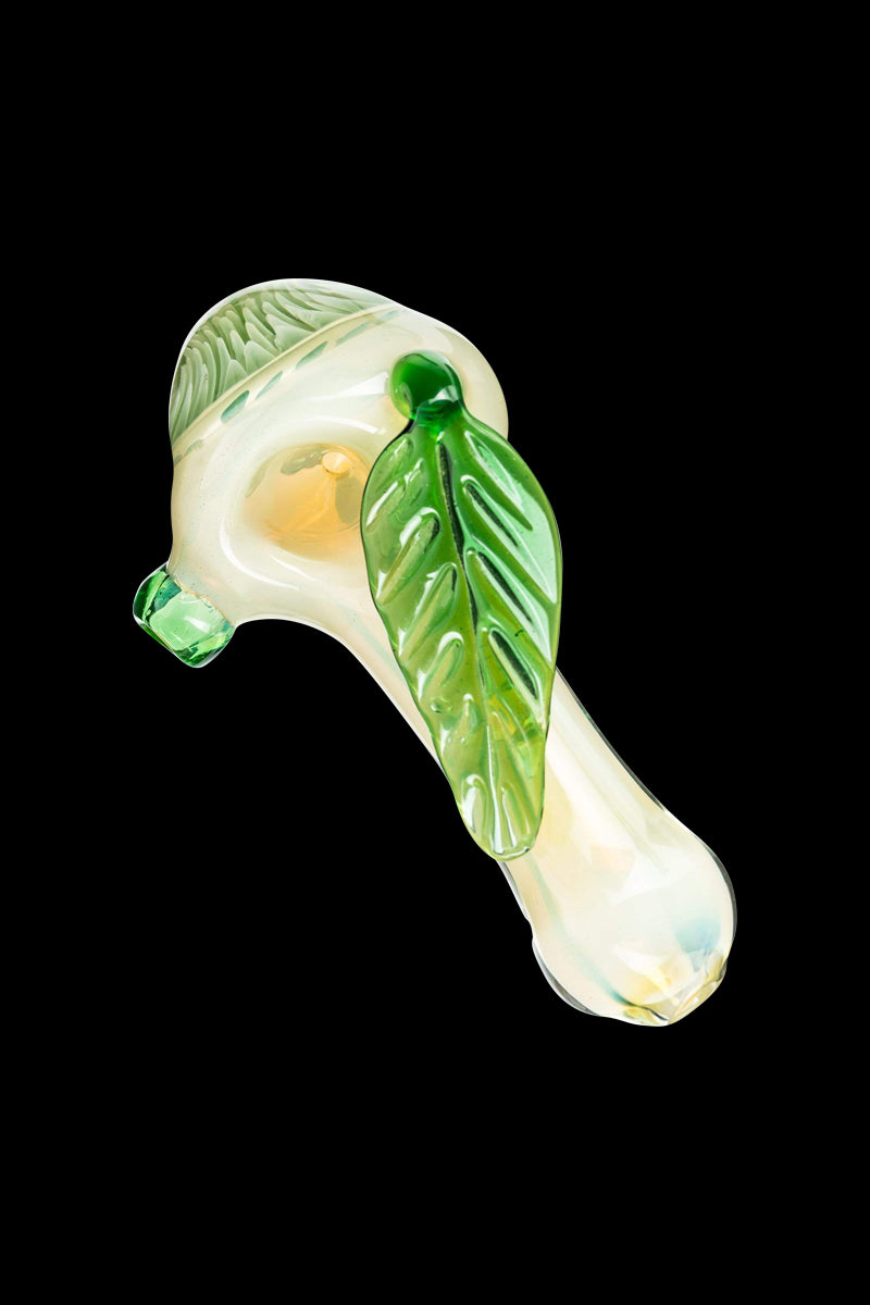 A side view of the Leafy Green Mushroom Milli Spoon Pipe, displaying its green, mushroom-shaped bowl and compact design.