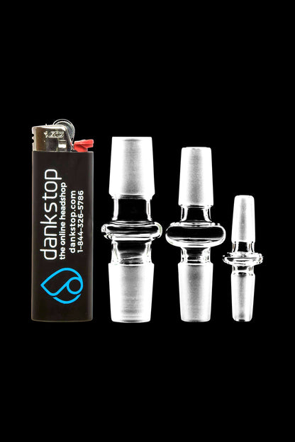 A slightly angled close-up of the Male to Male Glass Adapter, showcasing its clear glass construction against a dark background.