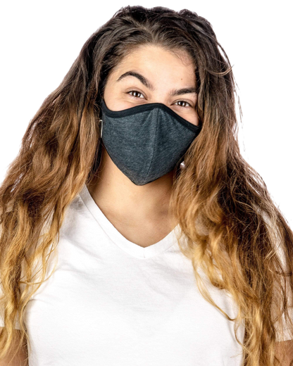 A front view of a person wearing the Reversible Cloth Mask, showcasing its simple design against a plain white background.