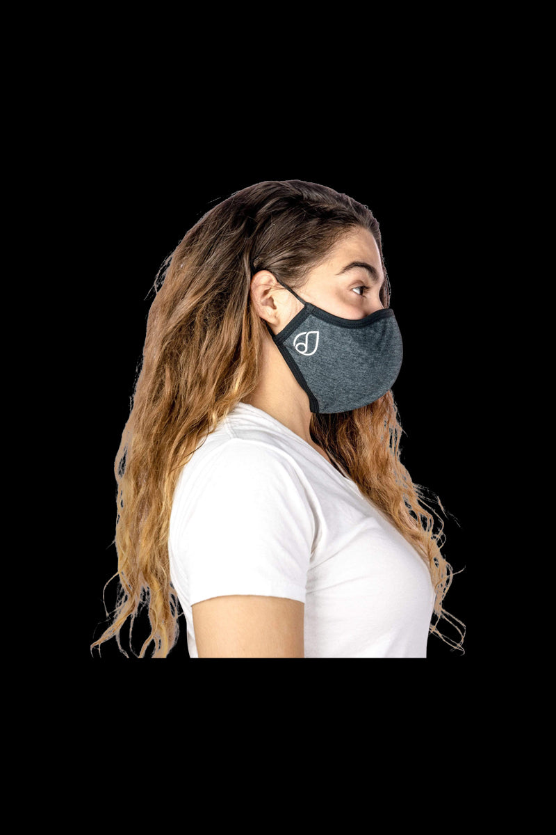 Side view of a person wearing the Reversible Cloth Mask, captured in soft, natural lighting.