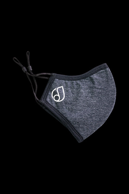Close-up of the Reversible Cloth Mask, a dark-colored fabric face covering against a plain background.