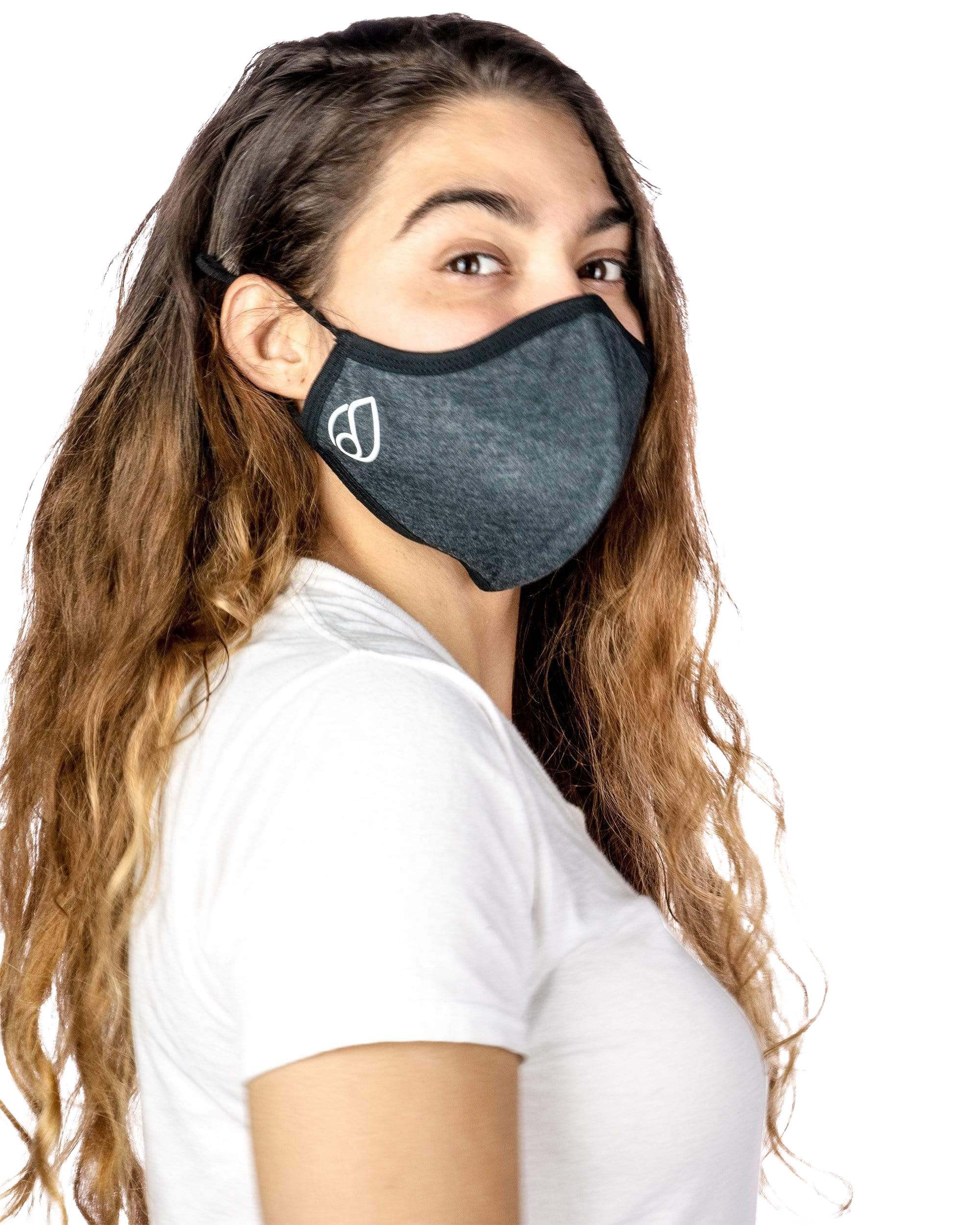 A woman wearing the Reversible Cloth Mask in a close-up, angled shot with soft lighting.