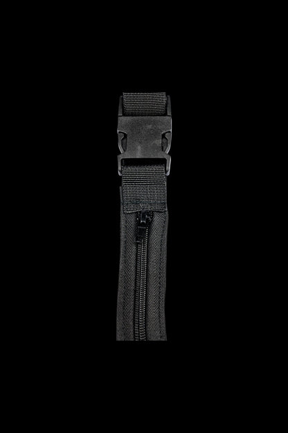 A close-up, angled view of the Secret Stash Belt featuring a black buckle and woven strap texture.