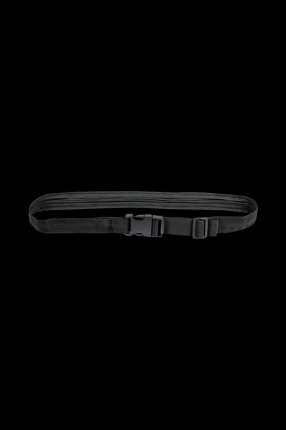 A top-down view of the Secret Stash Belt, a dark-colored fabric belt with a buckle, lying flat on a plain background.