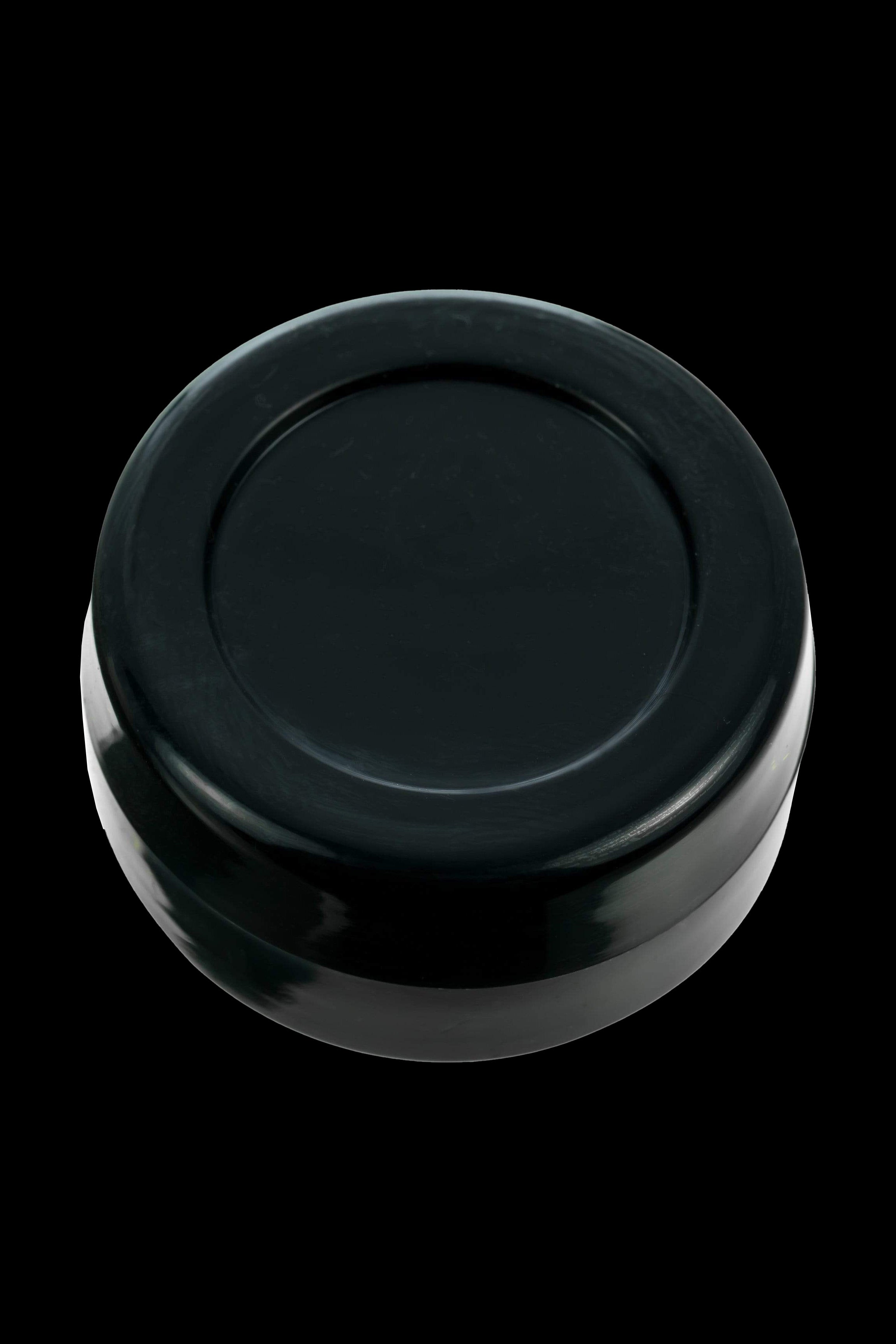 Black cannabis storage container, top view.