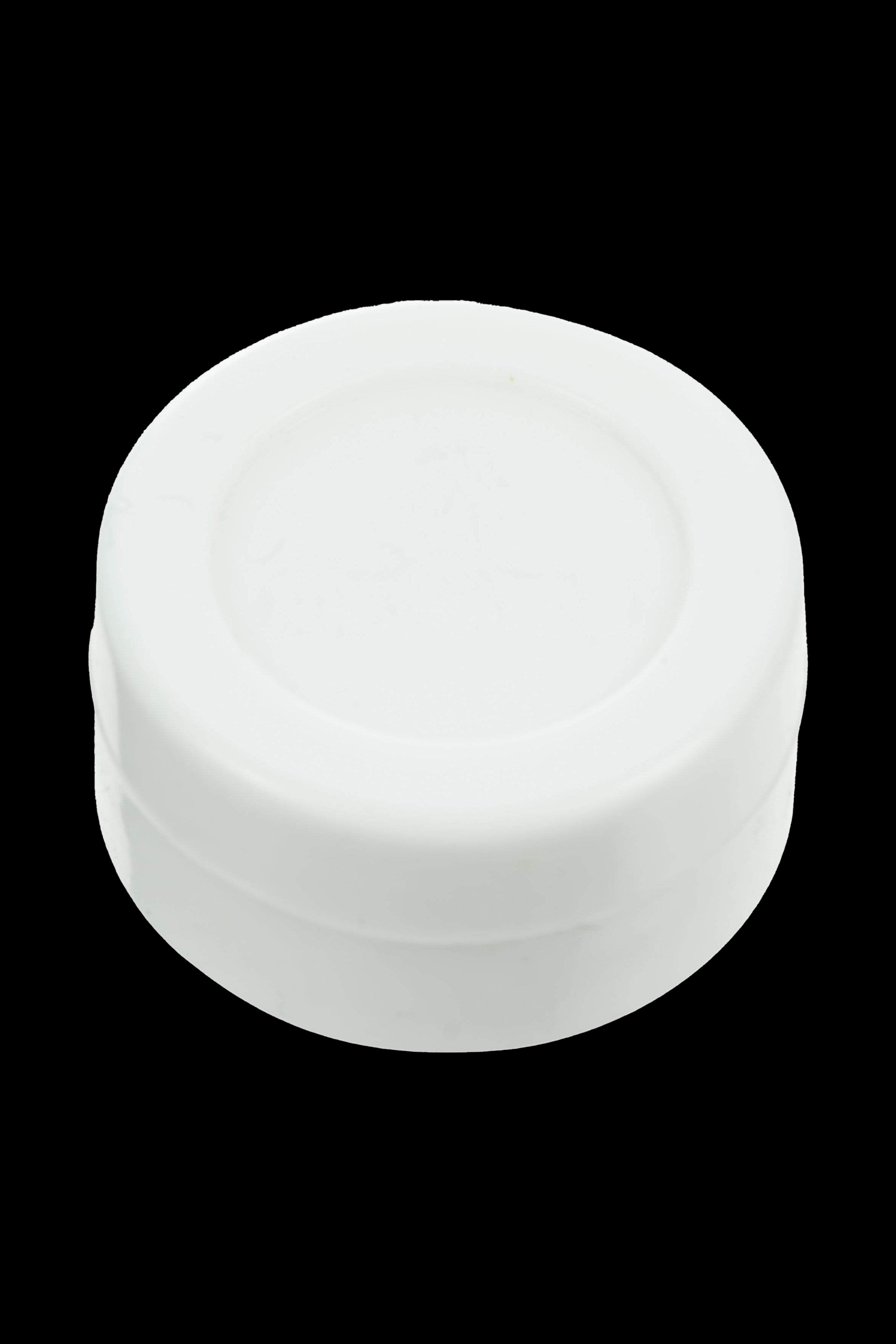 White silicone cap for cannabis concentrate container.
