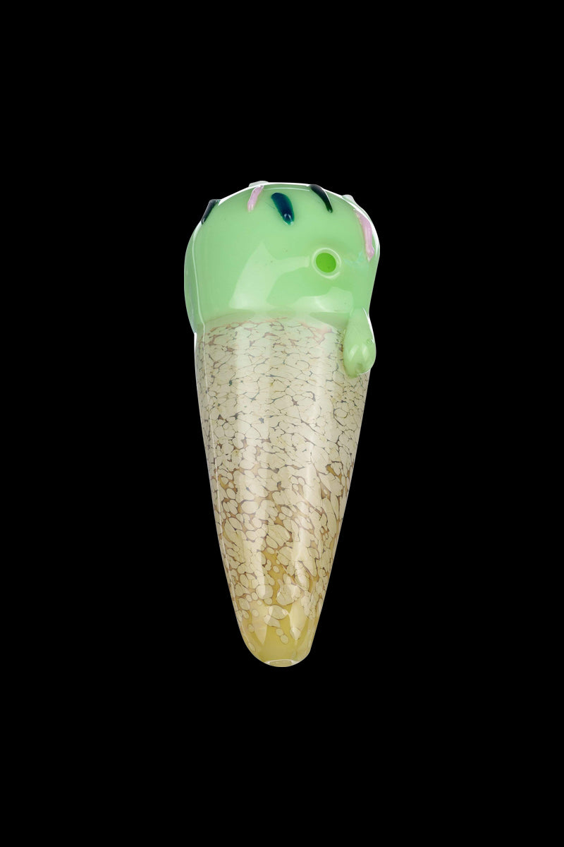 A close-up, angled view of the Single Scoop Ice Cream Spoon Pipe, showcasing its textured, golden-toned glass design.