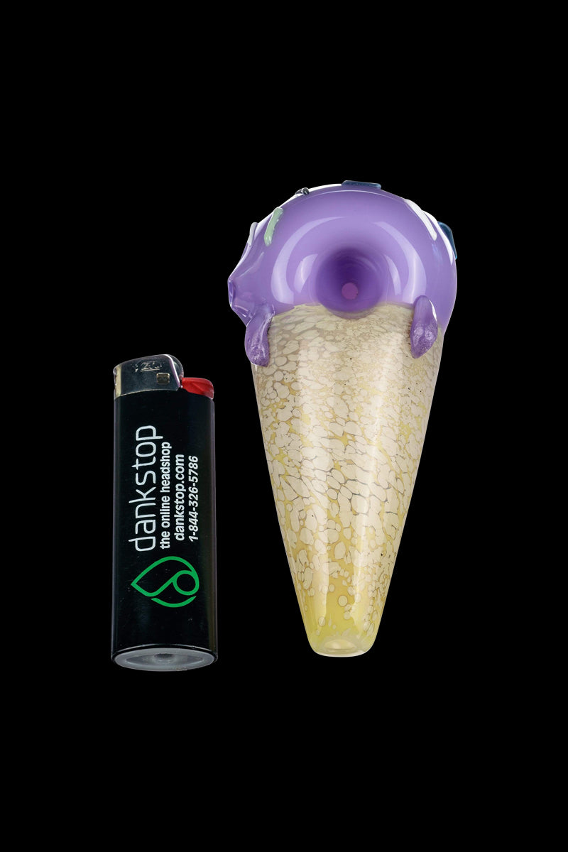 A close-up view of the Single Scoop Ice Cream Spoon Pipe, showcasing its sculpted glass design and colorful swirl pattern.