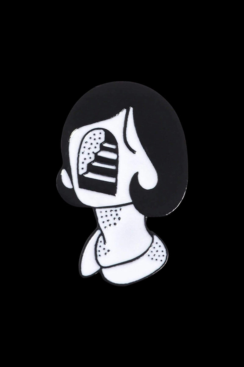 A close-up of the Stairface Enamel Pin, depicting a minimalist, white cartoon face with a staircase for a mouth.