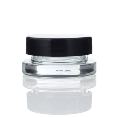 A studio shot of the Dip Devices 9mL Glass Container, displaying its clear glass construction and simple cylindrical shape.