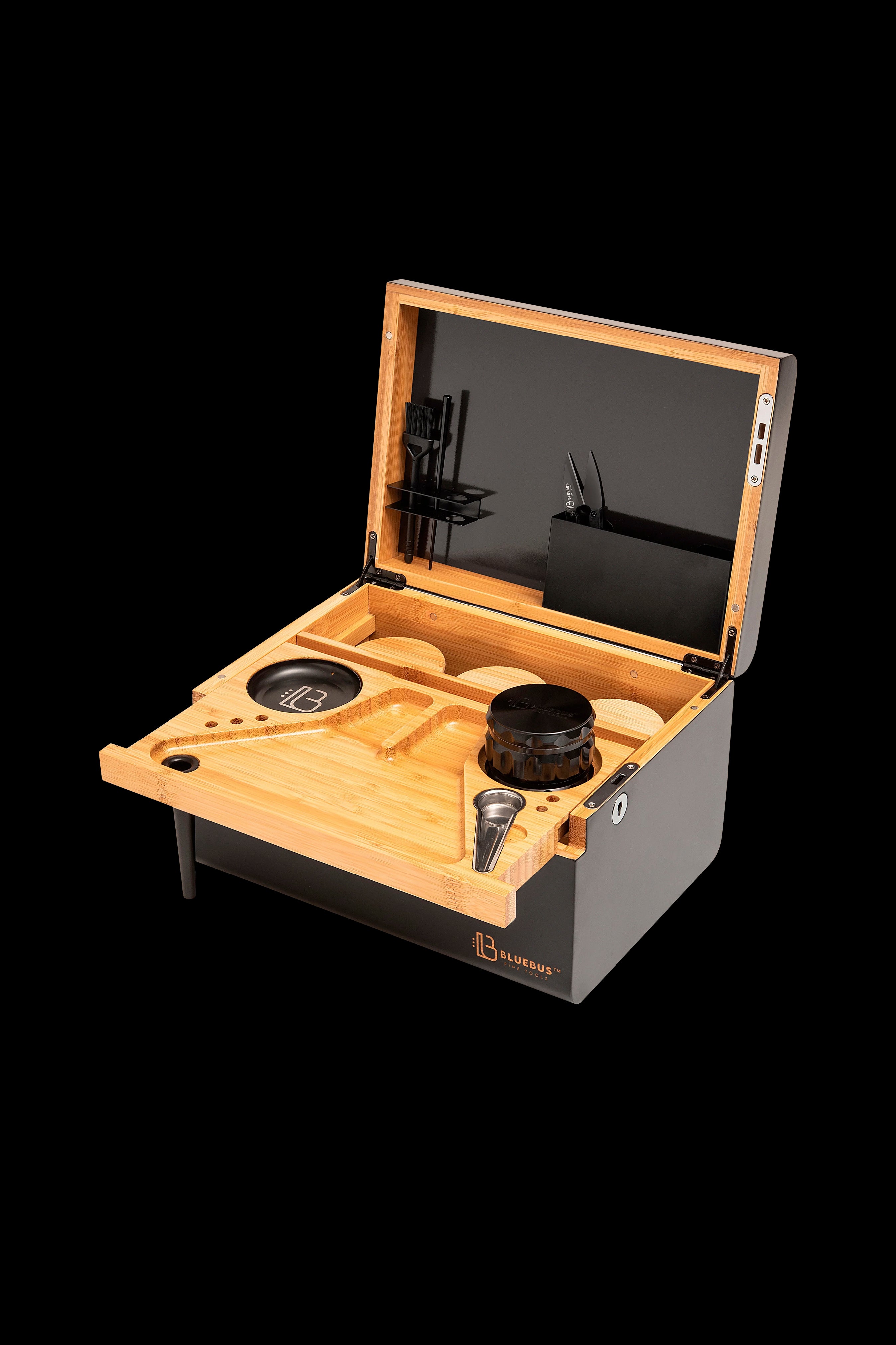 Wooden cannabis accessory kit with glass jars, tools, and storage compartments inside a black case.