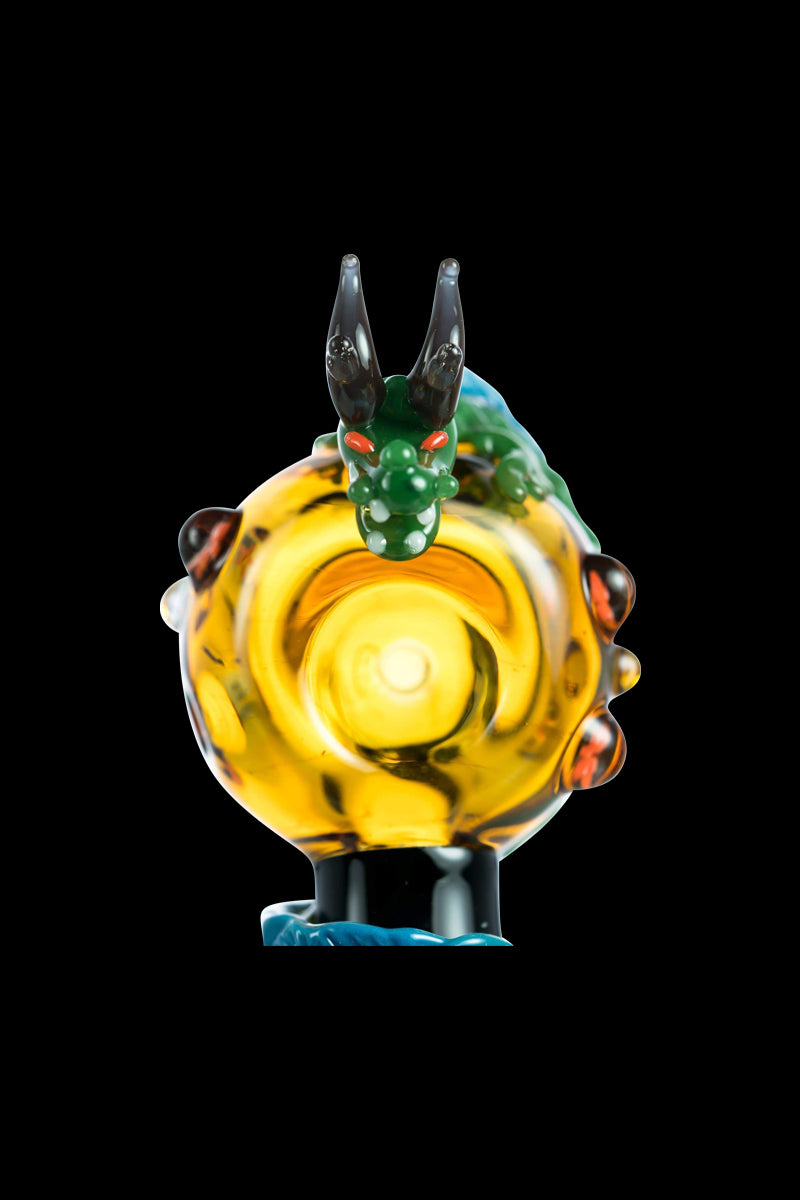 A front view of the Empire Glassworks Dragon Sphere Small Spoon Pipe, showcasing a vibrant, swirling glass design.
