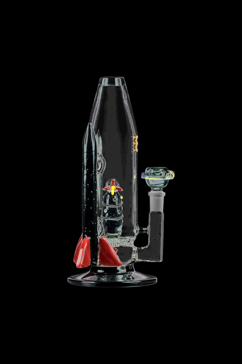 A side view of the Empire Glassworks Galactic Flagship Bong displays a clear glass design with colorful accents and a unique, sculpted form.